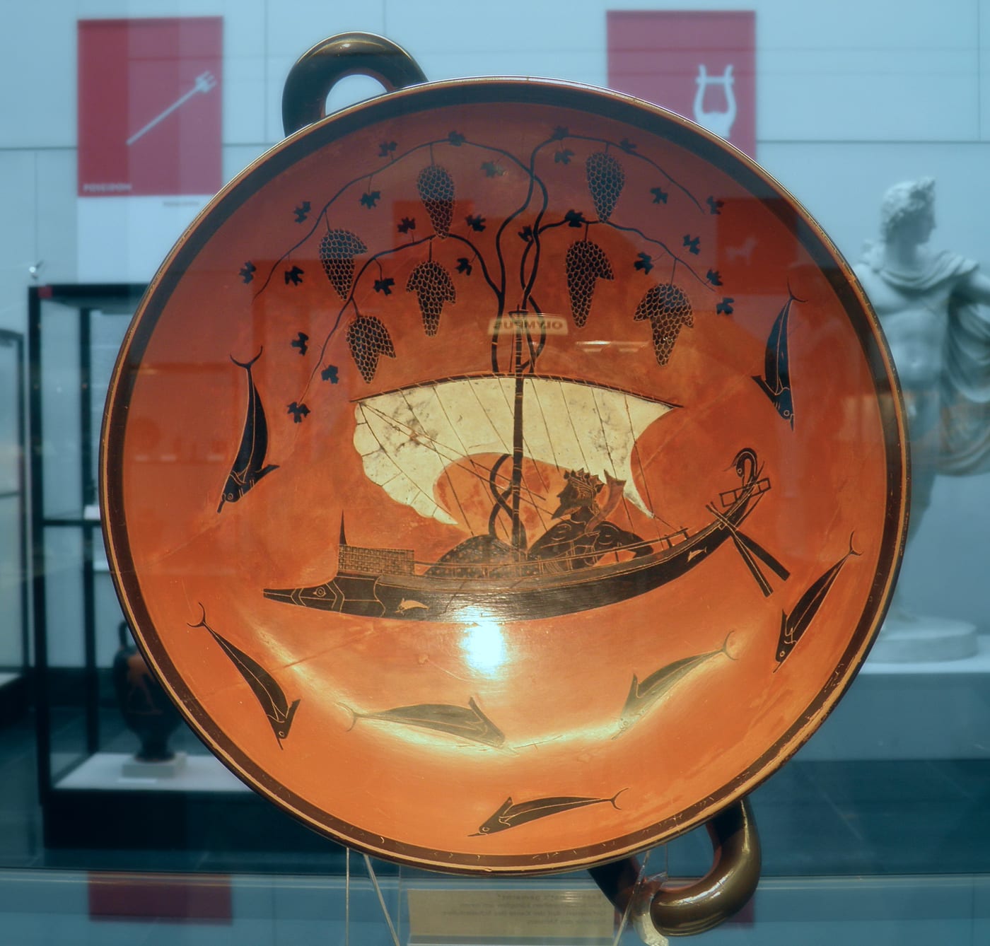 Attic black-figure kylix by Exekias showing Dionysus sailing surrounded by dolphins transforming from pirates, c. 530 BCE, Staatliche Antikensammlungen Munich — an ancient Greek marine creature tradition that parallels the hippocampus (sea-horse) of Poseidon's chariot.