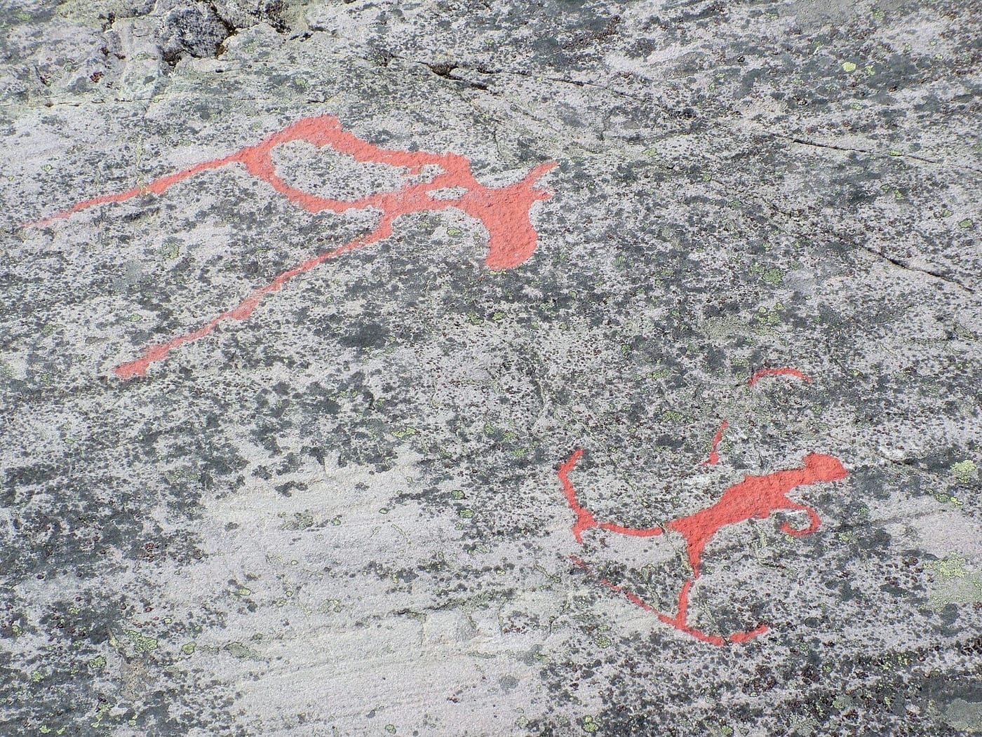 Prehistoric rock carving of an elk and skiing figure at the Alta rock art site, Finnmark, northern Norway, dated between roughly 4200 BCE and 200 CE.