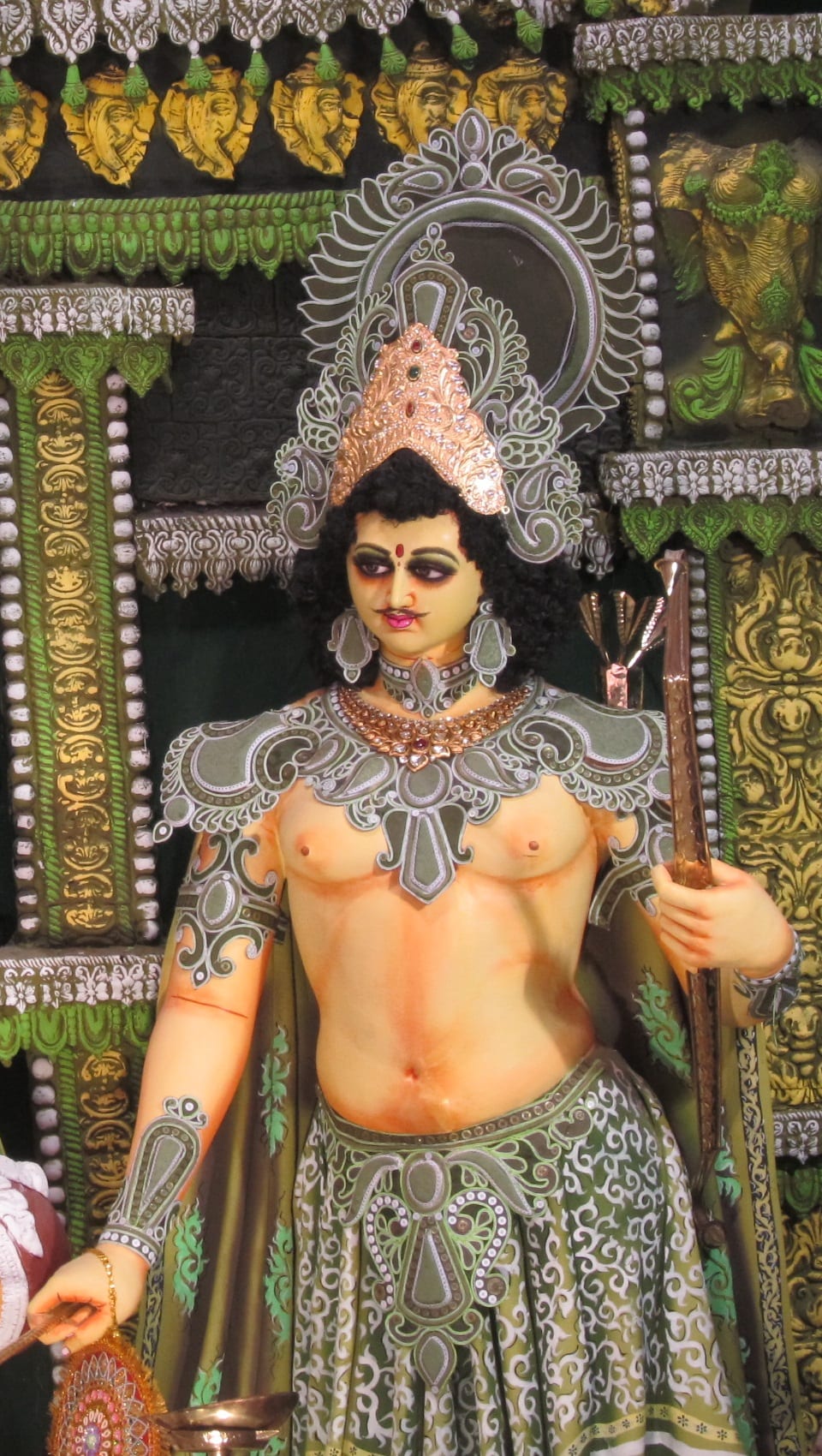Devotional image of Lord Kartikeya (Murugan) riding his peacock vahana during Durga Puja in Bengal, 2015.