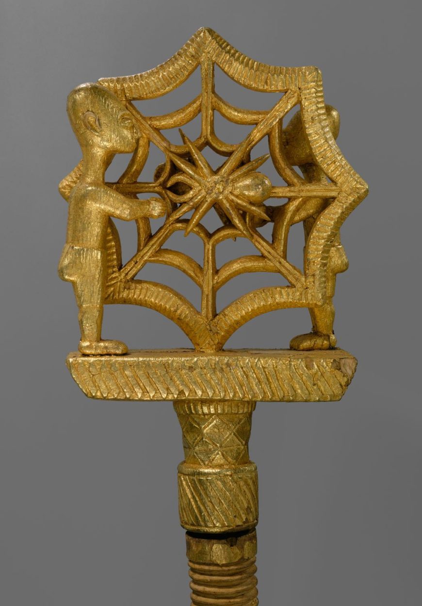 Gold-covered Akan linguist staff (okyeame poma) with carved spider and web motif, used as the staff of office for the linguist (spokesman) of an Asante chief, Metropolitan Museum of Art.