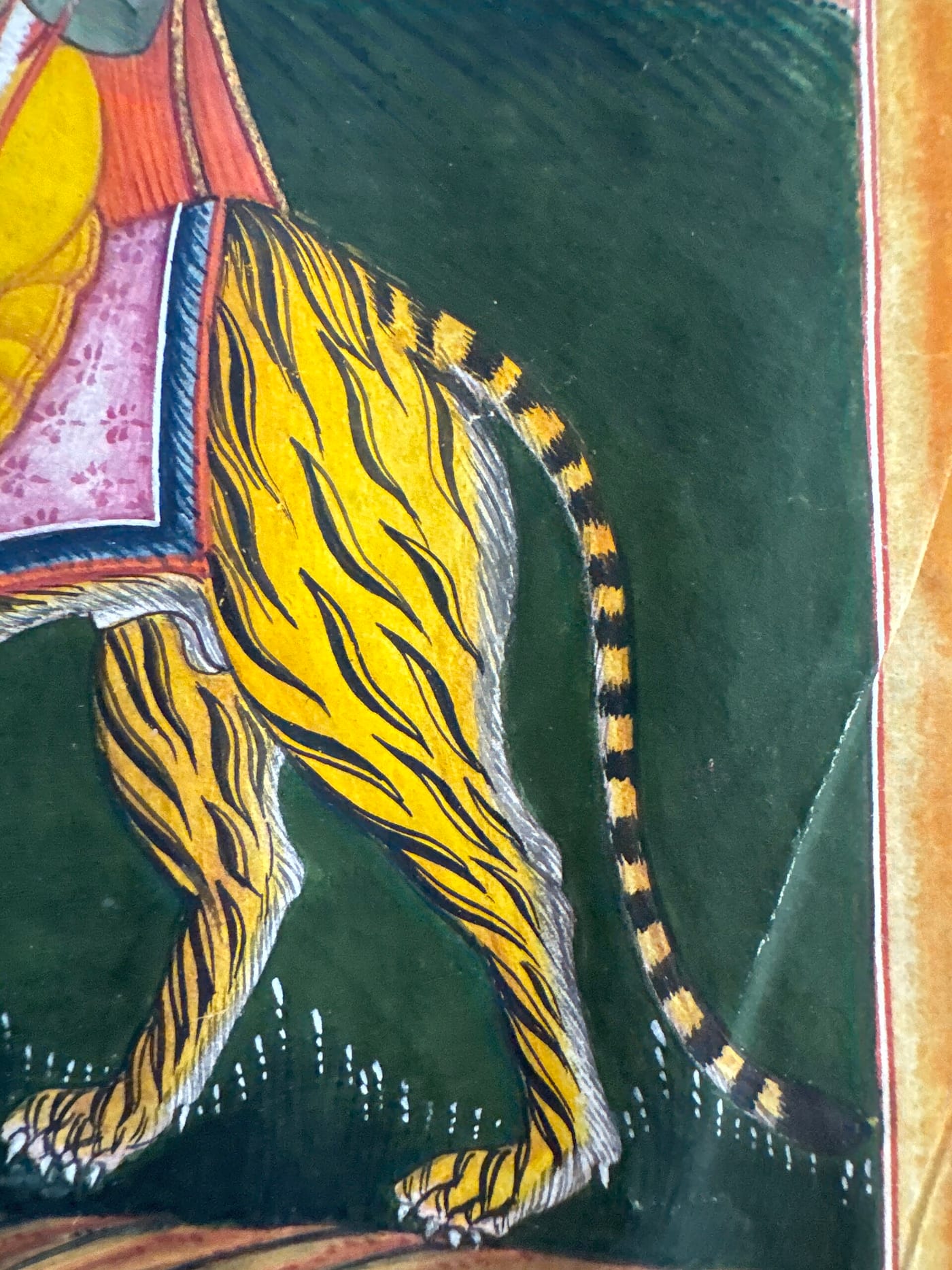 Pahari manuscript folio in opaque watercolor on paper depicting the Hindu goddess Durga riding a tiger, Punjab Hills style, circa 1790–1810.
