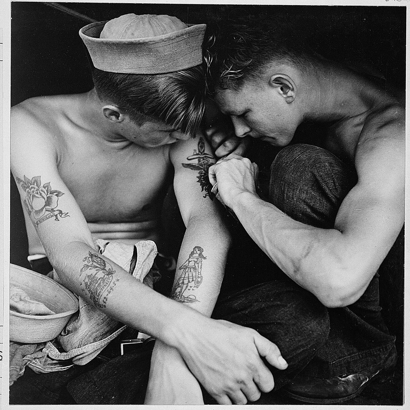 Much-tattooed sailor aboard the USS New Jersey, photographed by Charles Fenno Jacobs for the U.S. Navy, December 1944, NARA.
