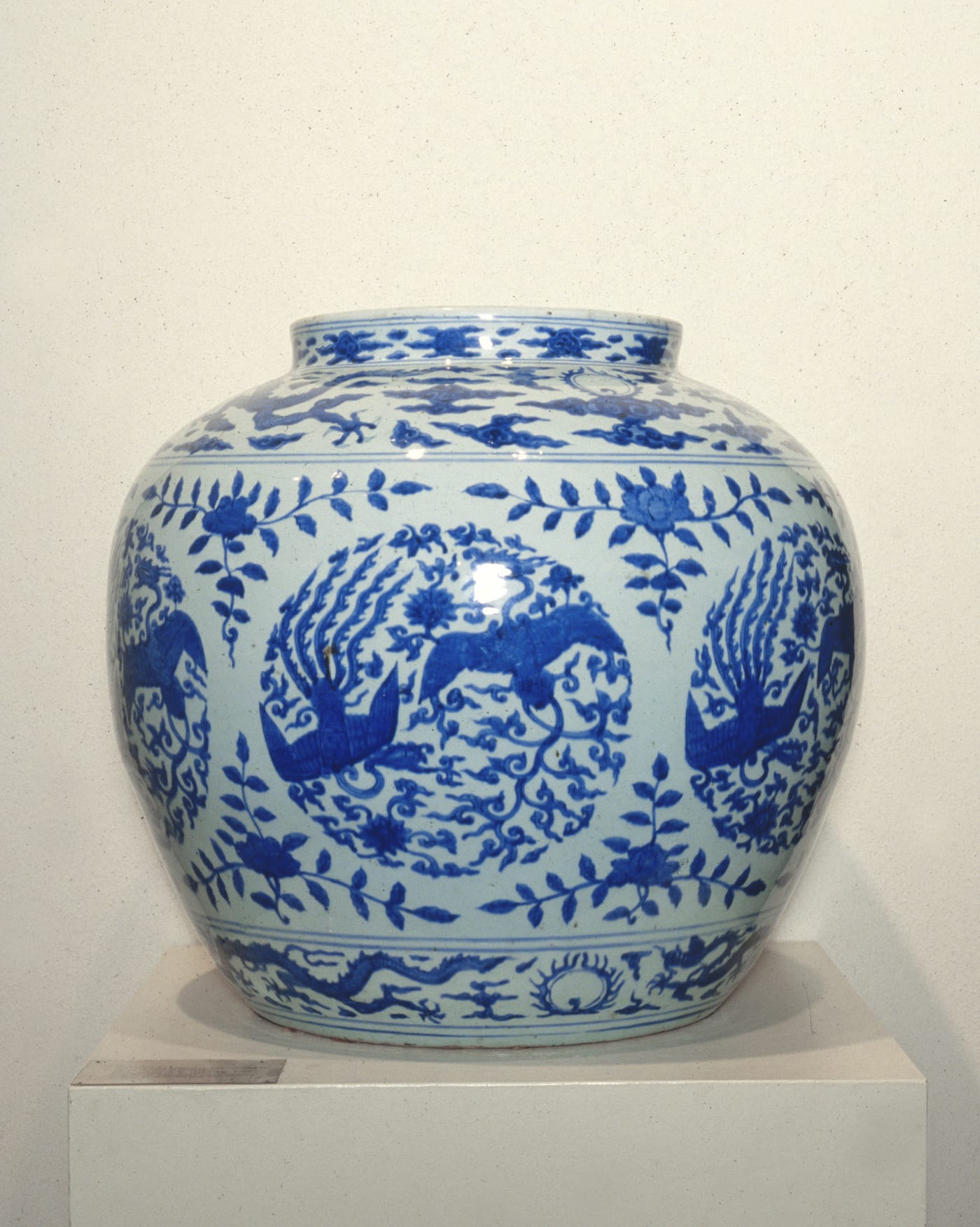 Ming Dynasty porcelain dish with blue and white fenghuang (phoenix) design, Xuande period 1426–1435 CE, showing a composite auspicious bird with elaborate plumage, Palace Museum Beijing.