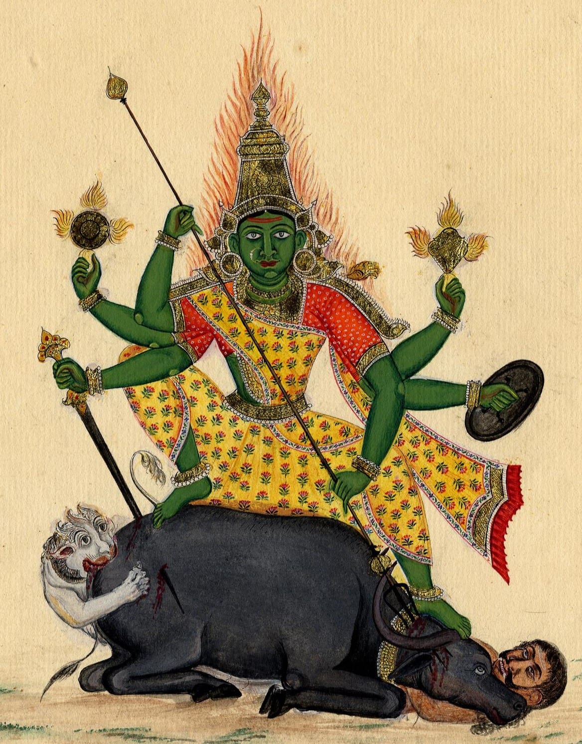 Stone sculpture of Durga as Mahishasuramardini standing on her lion and slaying the buffalo demon Mahisha.