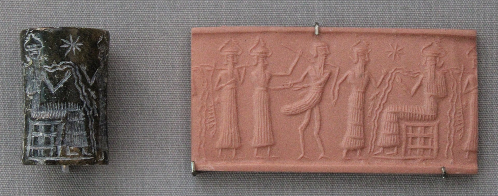 Akkadian cylinder seal impression showing the water-god Enki (Ea) pouring streams of water from two vases, with fish swimming in the streams, c. 2300–2100 BCE, British Museum.